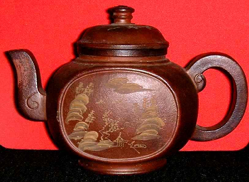 Brown clay tea cup with design